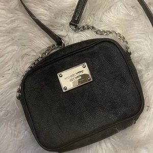 Authentic Gently worn black leather Michael Kors crossbody with silver accents.